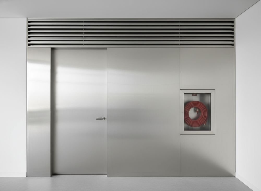 Linear grille over service doors